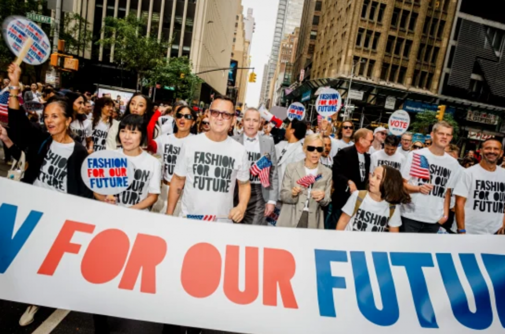 Image 2: Participants Marching Alongside “Fashion for Our Future” Banner1